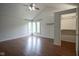 Bright bedroom featuring hardwood floors, a vaulted ceiling, and a walk-in closet at 4949 Jennings Dr, Carmel, IN 46033