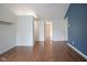Bedroom featuring wood floors and neutral walls, leading to a bathroom at 4949 Jennings Dr, Carmel, IN 46033
