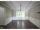 Well-lit dining room with hardwood floors, detailed trim, and a large window at 4949 Jennings Dr, Carmel, IN 46033