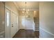 Bright foyer features hardwood floors, white trim, and modern lighting at 4949 Jennings Dr, Carmel, IN 46033