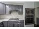 A close up of modern kitchen appliances including the microwave and oven at 4949 Jennings Dr, Carmel, IN 46033