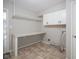 Laundry room features a built-in counter, upper cabinets, and hookups for a washer and dryer at 4949 Jennings Dr, Carmel, IN 46033