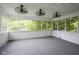 This sunroom has a white brick accent wall and ceiling fans at 4949 Jennings Dr, Carmel, IN 46033