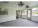 Enclosed sunroom with sliding glass doors and carpeted floor at 4949 Jennings Dr, Carmel, IN 46033