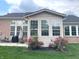 Lush backyard with green grass, a patio area, and roses bush perfect for outdoor enjoyment at 5010 Cabrillo Dr, Plainfield, IN 46168