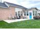 Backyard patio with an outdoor grill and a blue exterior door to the sunroom at 5010 Cabrillo Dr, Plainfield, IN 46168