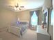 Comfortable bedroom with plush carpeting, ceiling fan, and bright natural light at 5010 Cabrillo Dr, Plainfield, IN 46168