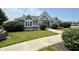 Community clubhouse entrance with well-manicured landscaping and ample parking at 5010 Cabrillo Dr, Plainfield, IN 46168