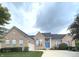 Charming brick home with a well-manicured lawn, driveway and basketball hoop at 5010 Cabrillo Dr, Plainfield, IN 46168