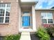 Inviting front entrance with a brightly painted blue door, sidelights and decorative features at 5010 Cabrillo Dr, Plainfield, IN 46168