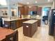 Modern kitchen with wood cabinets, stainless steel appliances, and center island at 5010 Cabrillo Dr, Plainfield, IN 46168