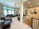 Comfortable living room with plush leather seating, fireplace and large windows at 5010 Cabrillo Dr, Plainfield, IN 46168