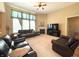 Inviting living room featuring a fireplace, large windows, and comfortable seating at 5010 Cabrillo Dr, Plainfield, IN 46168