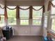 Bright sun room with multiple windows, natural light, and a view of the backyard at 5010 Cabrillo Dr, Plainfield, IN 46168