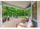 Relaxing covered back porch with seating area and a fire pit, perfect for outdoor enjoyment at 5558 Spicebush Dr, Indianapolis, IN 46254