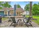 Picturesque backyard featuring a stone patio with a fire pit and seating area, ideal for outdoor gatherings at 5558 Spicebush Dr, Indianapolis, IN 46254