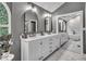 Elegant bathroom featuring dual vanities, sleek black fixtures, and a bright, spacious design at 5558 Spicebush Dr, Indianapolis, IN 46254