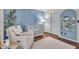 Charming Bedroom featuring a cozy chair, crib, and whimsical book display at 5558 Spicebush Dr, Indianapolis, IN 46254