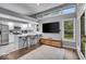 Modern kitchen featuring white cabinetry, stainless steel appliances, and ample counter space at 5558 Spicebush Dr, Indianapolis, IN 46254