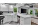 Bright kitchen offers stainless appliances, and ample counter space with natural light at 5558 Spicebush Dr, Indianapolis, IN 46254