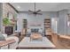 Inviting living room features a stone fireplace, hardwood floors, and stylish furnishings at 5558 Spicebush Dr, Indianapolis, IN 46254