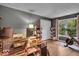 Bright home office with a large window, workout equipment, and organized bookshelves at 5558 Spicebush Dr, Indianapolis, IN 46254