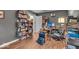Functional home office with custom shelving, ample workspace, and natural light at 5558 Spicebush Dr, Indianapolis, IN 46254