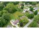 Stunning aerial view featuring residential properties, lush greenery, and well-maintained lawns at 5631 N Olivia Dr, Alexandria, IN 46001