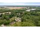 Breathtaking aerial perspective with lush greenery, homes, lake, and farmland in the distance at 5631 N Olivia Dr, Alexandria, IN 46001