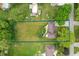 Aerial view of a large lot outlined in blue, showing expansive green space at 5631 N Olivia Dr, Alexandria, IN 46001