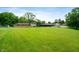 Large backyard with green grass and trees; house in background at 5631 N Olivia Dr, Alexandria, IN 46001