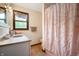 Bathroom features a single vanity, a window, and a floral shower curtain at 5631 N Olivia Dr, Alexandria, IN 46001