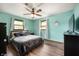 Comfortable bedroom with a ceiling fan, wood floor, and large windows at 5631 N Olivia Dr, Alexandria, IN 46001