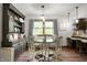 Cozy dining room with elegant decor, including a chandelier, table with seating for four, and built-ins at 5631 N Olivia Dr, Alexandria, IN 46001