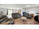 Spacious living room features a neutral color palette, wood floors, and comfortable sofas at 5631 N Olivia Dr, Alexandria, IN 46001