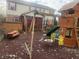 Spacious backyard featuring a playset, bench, and plenty of room for recreation and relaxation at 5698 Yorktown Rd, Plainfield, IN 46168