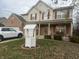 Charming two-story home with well-maintained lawn, garden, and a decorative wishing well at 5698 Yorktown Rd, Plainfield, IN 46168