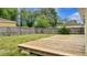 Backyard featuring a deck and green grass at 5806 E 19Th St, Indianapolis, IN 46218