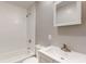 Bathroom features a white vanity, toilet, and a shower over the tub at 5806 E 19Th St, Indianapolis, IN 46218