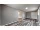 A spacious bedroom with gray walls and hard surface floors at 5806 E 19Th St, Indianapolis, IN 46218