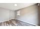 An empty bedroom featuring hard surface floors and a window at 5806 E 19Th St, Indianapolis, IN 46218