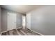 An empty bedroom with hard surface floors and neutral-colored walls at 5806 E 19Th St, Indianapolis, IN 46218