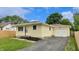 Charming yellow home with attached garage and inviting front yard, perfect for suburban living at 5806 E 19Th St, Indianapolis, IN 46218