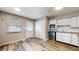 Well-lit kitchen with white cabinetry, modern appliances, and functional layout, perfect for cooking at 5806 E 19Th St, Indianapolis, IN 46218