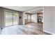 Open living room showing kitchen access, with modern flooring and lots of natural light at 5806 E 19Th St, Indianapolis, IN 46218