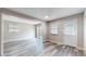 Bright living room with sliding doors, windows, and modern flooring at 5806 E 19Th St, Indianapolis, IN 46218