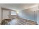 Bright living room with large window and modern flooring, creating an open and airy space at 5806 E 19Th St, Indianapolis, IN 46218