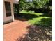 Lush backyard featuring a brick patio and beautiful green lawn at 5889 Crestview Ave, Indianapolis, IN 46220