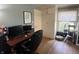 Bedroom with hardwood floors, built-in storage, and a view from a bright window at 5889 Crestview Ave, Indianapolis, IN 46220