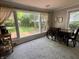 Dining room featuring a large window that looks out to the backyard and a dining table at 5889 Crestview Ave, Indianapolis, IN 46220